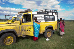 Women & their babies happy to see the FP vehicle!