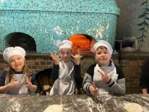 Making pizza with children affected by war