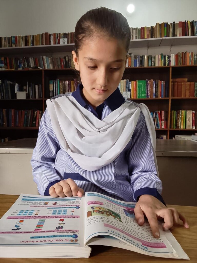 close-up of the girl reading.