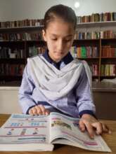 close-up of the girl reading.