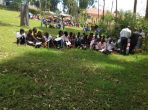 Girls completing surveys identifying priorities