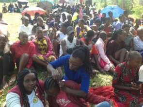 Girls waiting for supplies and mentorship activity