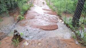 Flood water flowing between release enclosures