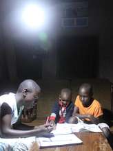 Students study by a solar light