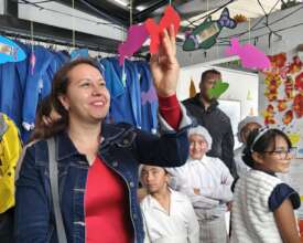 Mother looking at her son's artwork