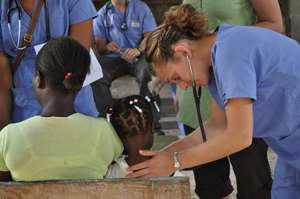 Medical students looking after kids in the clinic
