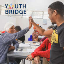 Students work with mentors in Youth Bridge classes