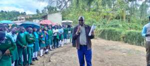 PLANE Director Sensitizing students at Kitumba Sec