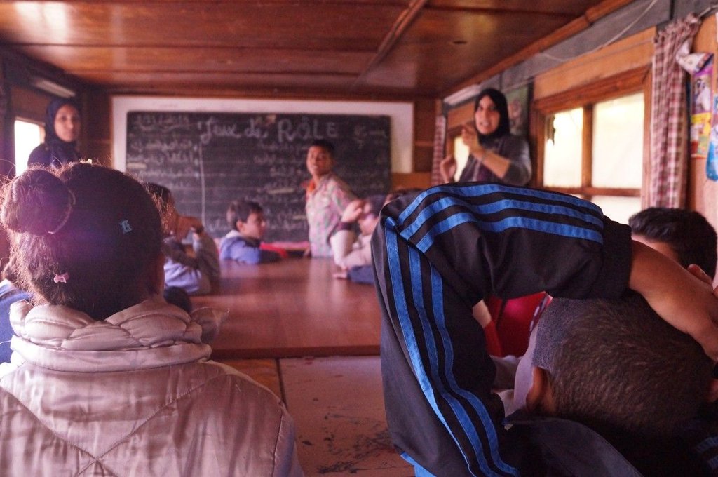 Children in a toturing session