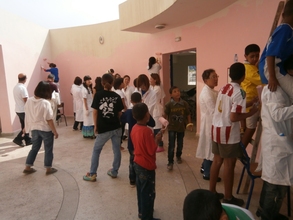 The children paint their building