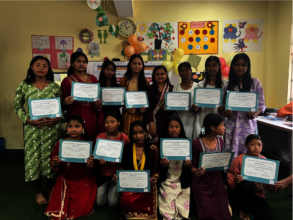 Girls receive their certificates upon completion
