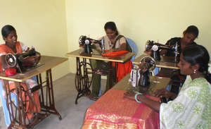 Young girls learning Tailoring