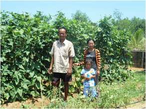 Meas Samon with his wife and daughter
