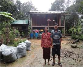 Ket Thy and Pov Sean in front of their new home