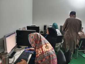 Female students working at computers.