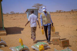 TF staff supports families with food distribution