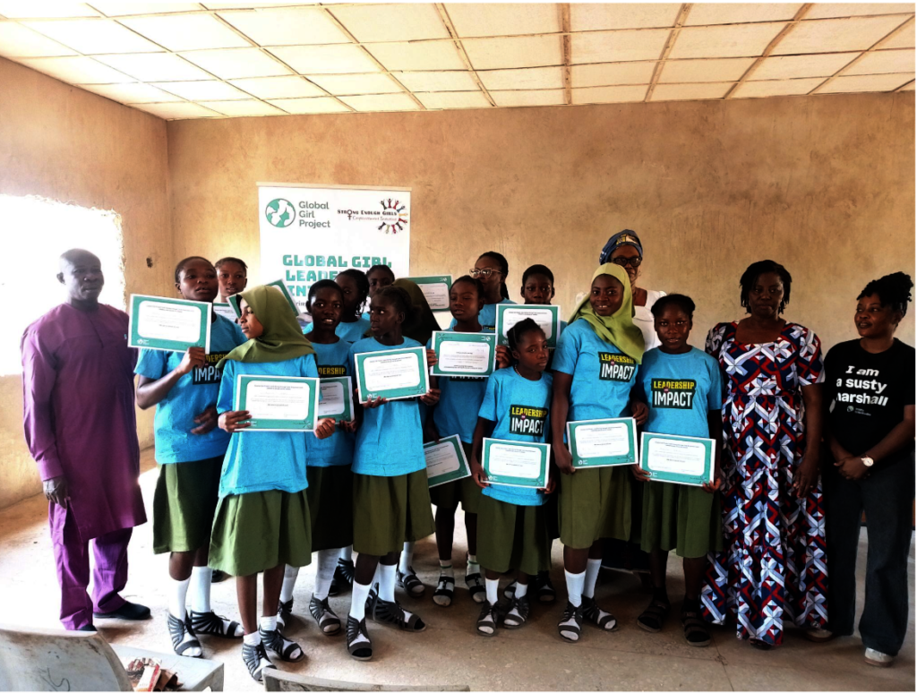 Girls receive their certificates upon completion