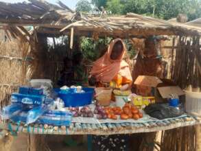 Nefisa at her grocery and vegetable stall