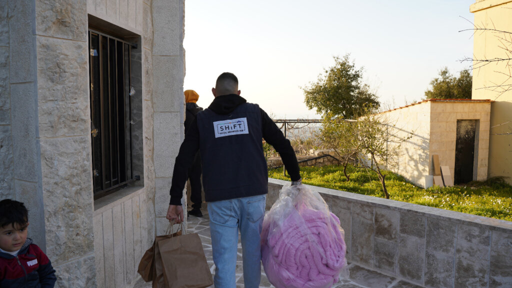 Distributing Blankets for displaced people