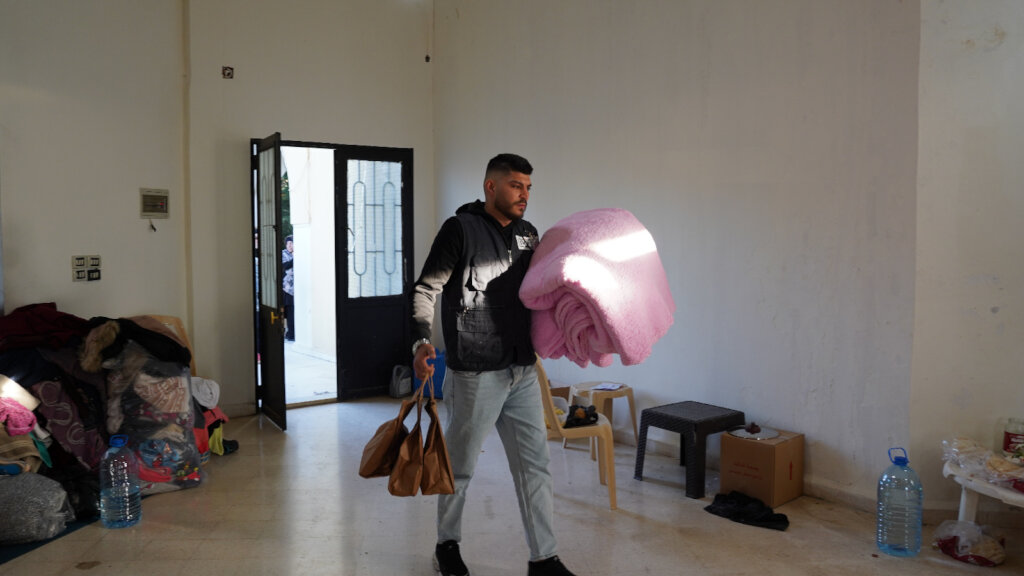 Distributing Blankets for displaced people