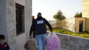 Distributing Blankets for displaced people