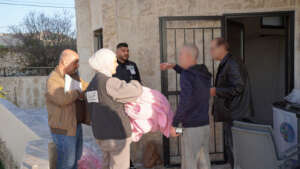 Distributing Blankets for displaced people