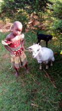 A BENEFICIARY MOTHER IMMUNIZING HER CHILD