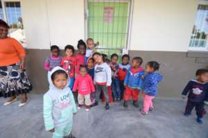 Students in front of Love to Langa Classroom