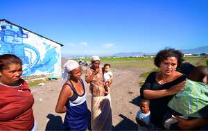 Tyron, his mother (in blue) and other farm workers