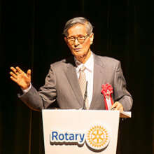 Dr. Shigeru Omi speaks at a Rotary district confer