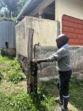 Handwashing outside school latrine