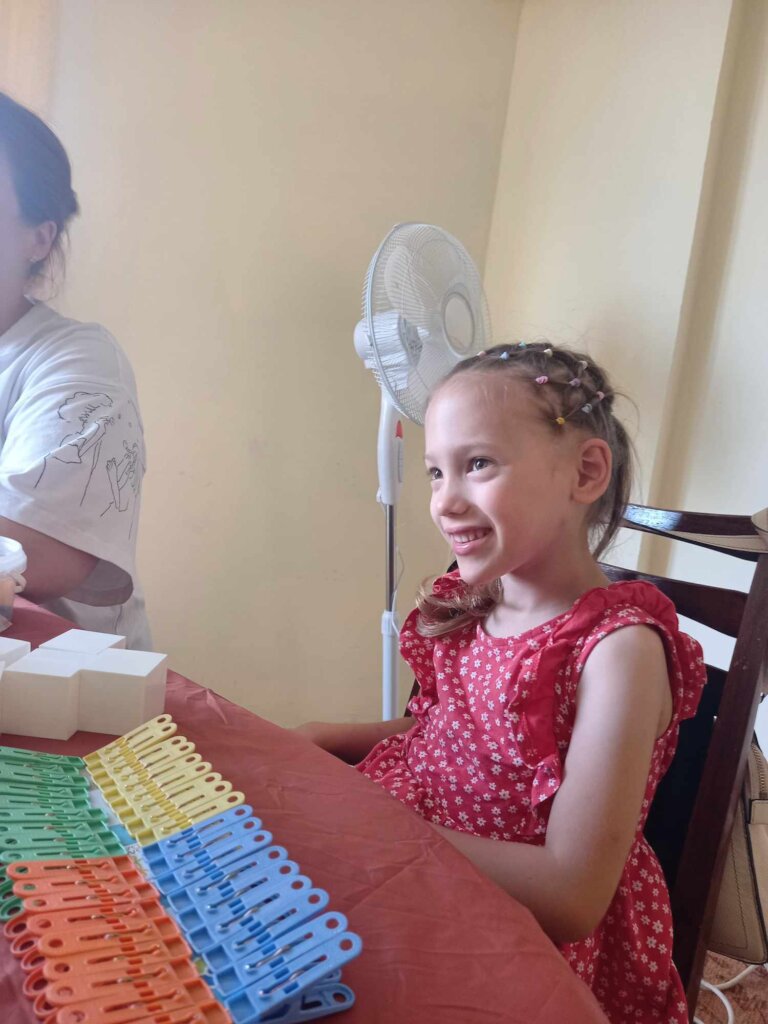 Blind children in the warm palms of art