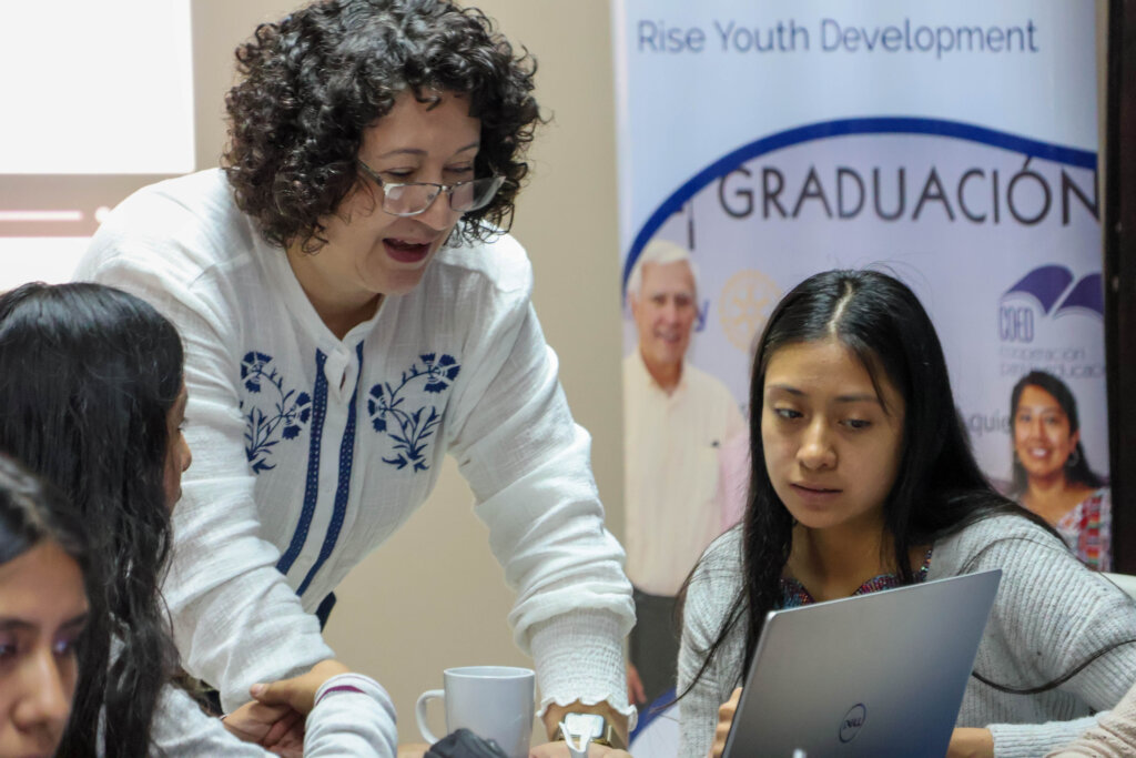 Director of Education, Mirna, guides students.