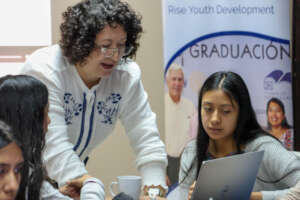 Director of Education, Mirna, guides students.
