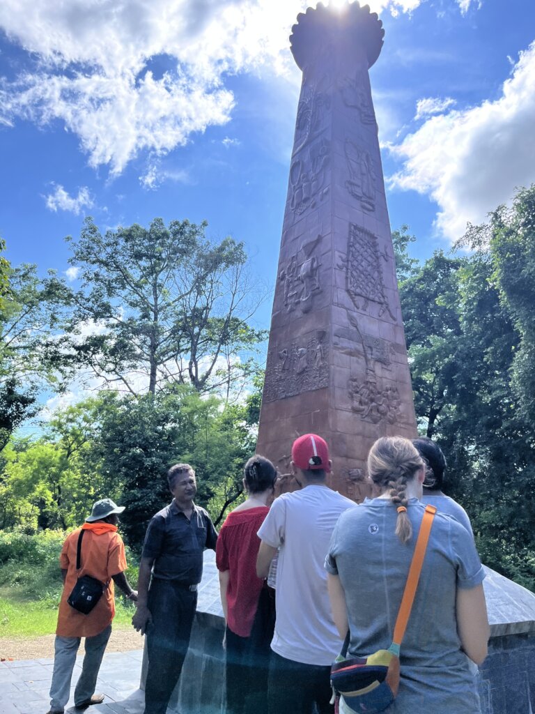 Students visit a memorial to victims in Bardiya
