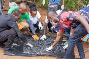 Youth Sorting Biochar for Briquettes