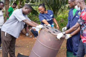 Youth learning the Carbonization Process