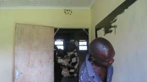 The door goes on nd the chalkboard is painted