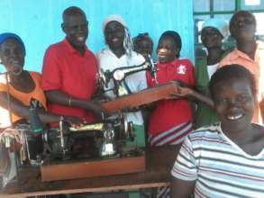 Women Ecstatic To Receive Sewing Machines