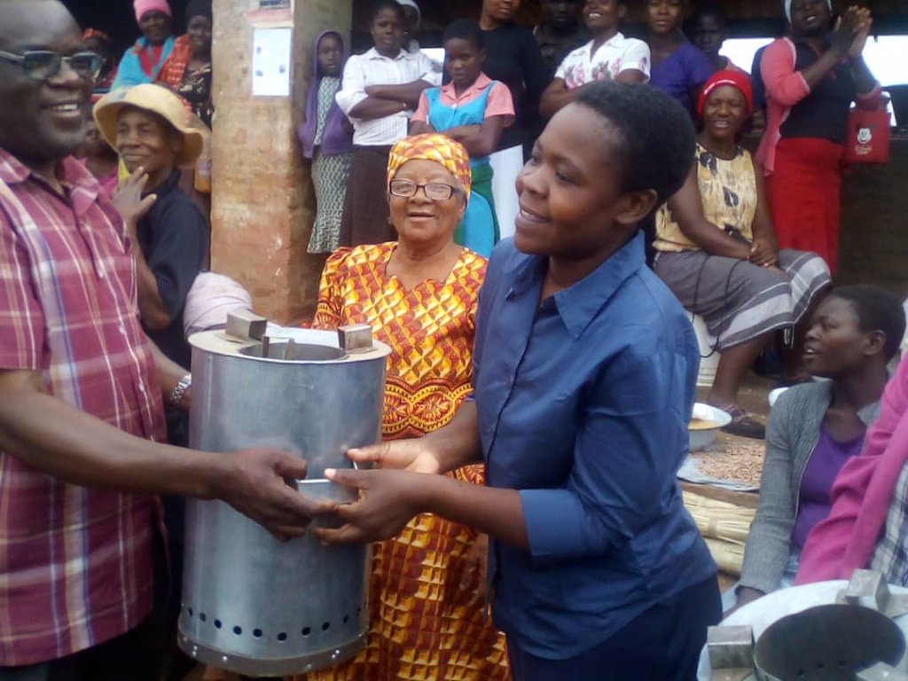 Women receiving energy efficient stoves