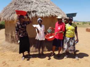 Caregivers Distributing Basins, Rice and Soap