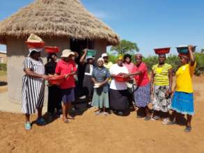 Caregivers Distributing Basins, Rice and Soap
