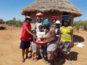 Caregivers Distributing Basins, Rice and Soap