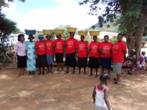 Caregivers Distributing Basins, Rice and Soap