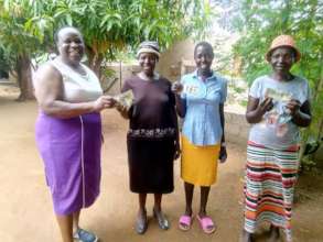 Pig Rearing Project Leaders Receiving Money