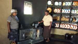 Women From Jekesa Pfungwa Demoing The Mud Stove