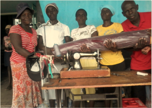 Women Ecstatic To Receive Sewing Material