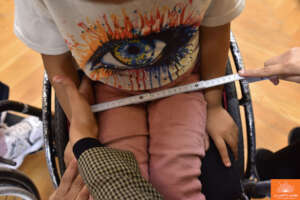 Taking wheelchair measurements for a girl
