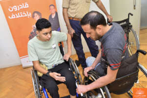 Taking wheelchair measurements for a beneficiary