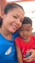 Team Leader, Sary, with a young patient.